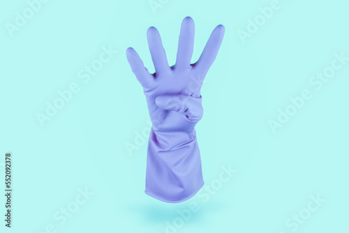 Wallpaper Mural Light blue cleaning glove floating in the air counting 4 on cian background Torontodigital.ca