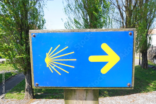 Way of St James , Camino de Santiago , yellow arrow sign to Compostela , Galicia, Spain