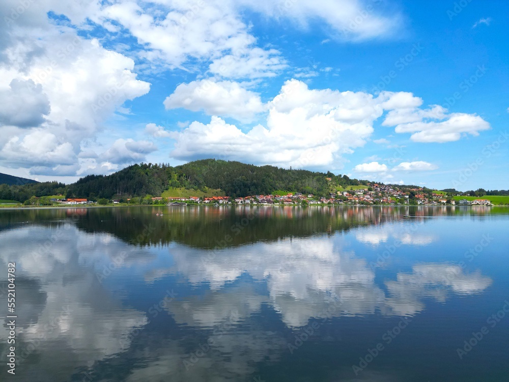 Hopfensee lake and town Hopenfen Swabia Bavaria Germany drone aerial view Hopfensee lake and town Hopenfen Swabia Bavaria Germany drone aerial view