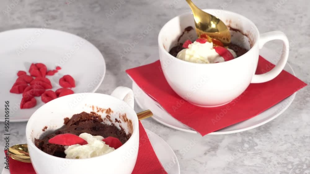 Step by step. Chocolate mug cakes garnished with whipped cream and chocolate hearts and lips. Step by step. Chocolate mug cakes garnished with whipped cream and chocolate hearts and lips.