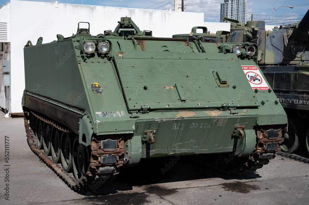 Detail of a small tracked light armored vehicle FMC Corporation M106 in camouflage green Detail of a small tracked light armored vehicle FMC Corporation M106 in camouflage green