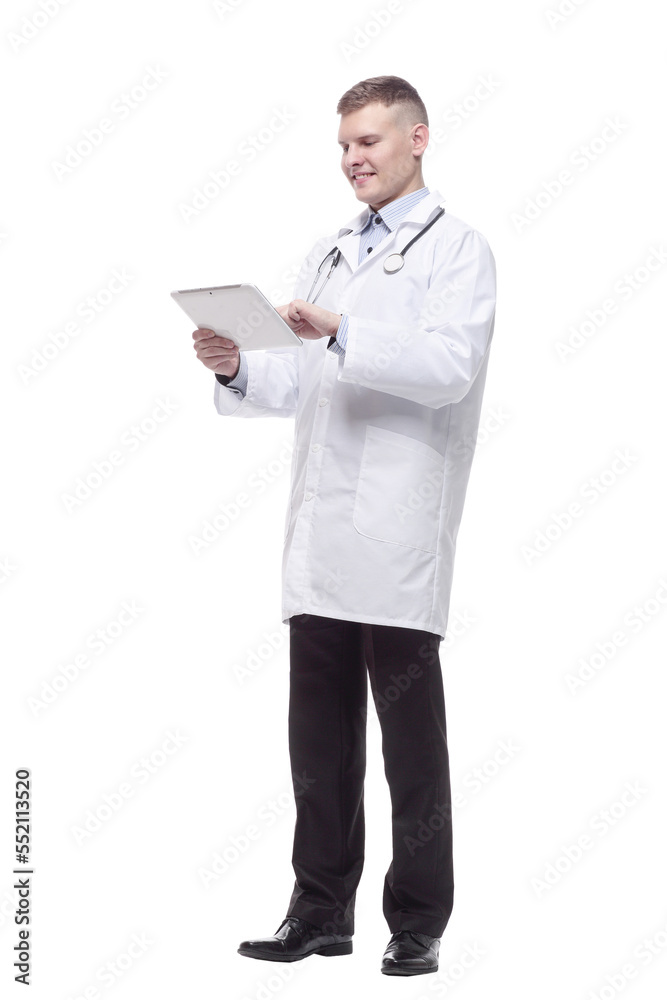 in full growth. young doctor with a digital tablet. in full growth. young doctor with a digital tablet.