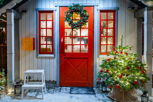 Christmas house with decoration on the door.