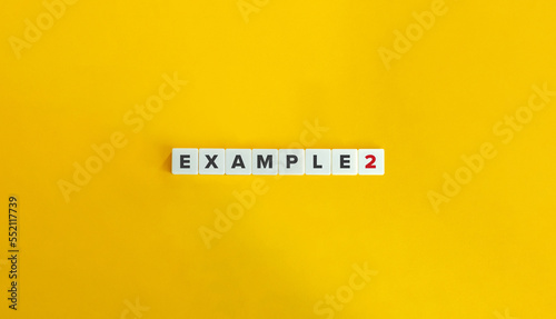 Example 2 (Two) Text on Block Letter Tiles on Yellow Background. Minimal Aesthetics. photo