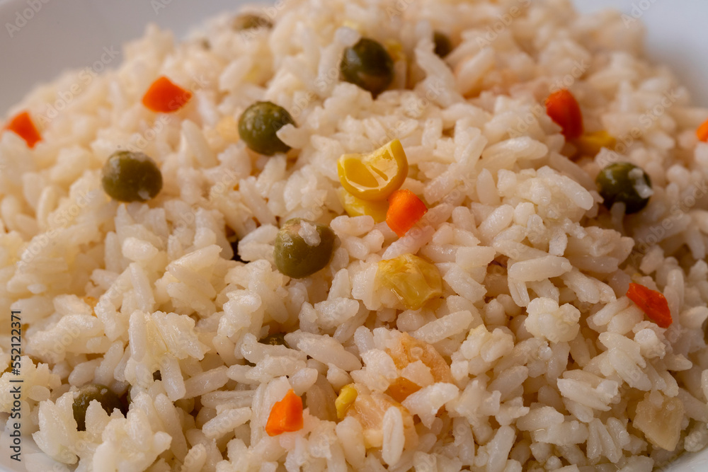 Vegan rice with vegetables, shot from above on a black background
Vegan rice with vegetables, shot from above on a black background