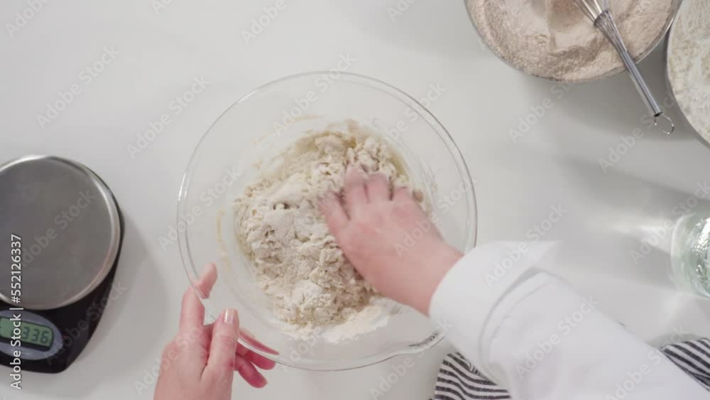Flat lay. Measuring ingredients into a glass bowl to bake cinnamon rolls. Flat lay. Measuring ingredients into a glass bowl to bake cinnamon rolls.