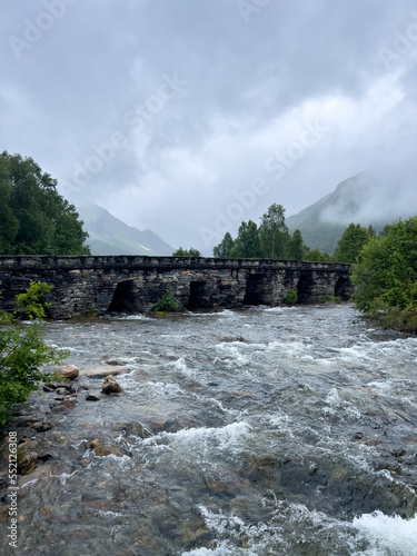 old stone bridge over a river