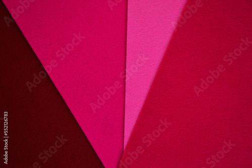 color abstract background for decoration. felt sheets of burgundy color. lines, geometry. viva magenta, the color of the year.