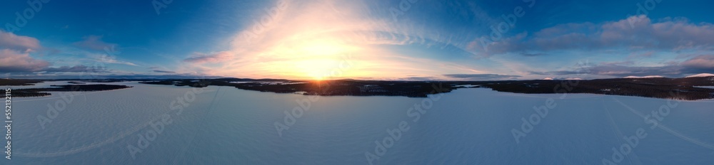 stunning panorama of frozen lake during sunset