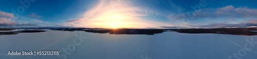 stunning panorama of frozen lake during sunset