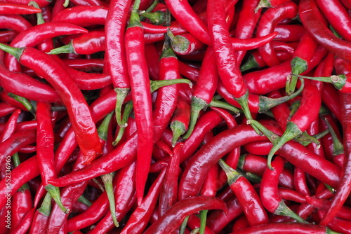 Red chili hot chili pepper pattern texture background. Red hot chili peppers background. Garden vegetable market. Group of red chili peppers