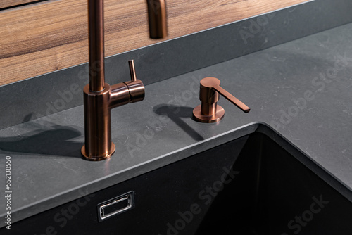 Sink and faucet in the kitchen in black