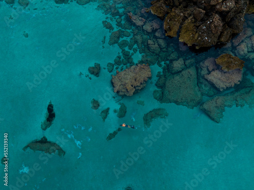 Aerial views with person snorkeling off the coast of Europe