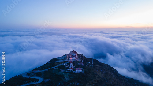 4k aerial views with drone. Monastery of Monte Toro, in the centre of the island of Menorca, Balearic Islands.
