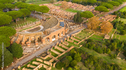 Aerial view on the Roman theatre of Ostia Antica, a large archaeological site, close to the modern town of Ostia. The ancient Roman Amphitheater is located in Rome, Italy. photo