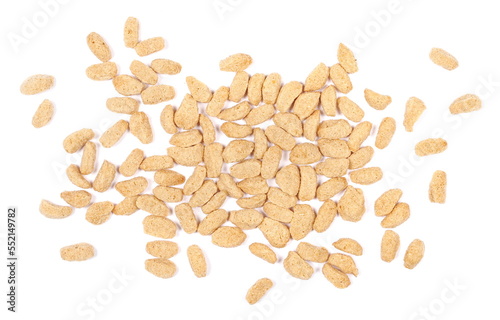 Extruded crunchy oat flakes, pile isolated on white, top view