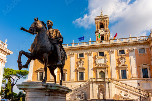 Statue of Marcus Aurelius and Conservators Palace (Palazzo dei Conservatori) on Capitoline Hill in Rome, Italy photo