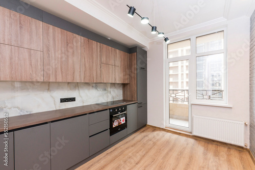 Built-in kitchen in a new apartment, a workspace in the kitchen in a restrained style