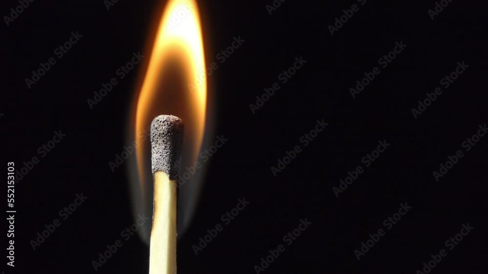 Igniting Match and Flame on a Black Background. Slow Motion. Close-up. Lot of Smoke. After Burns out leaving behind a charred wood matches. Igniting Match and Flame on a Black Background. Slow Motion. Close-up. Lot of Smoke. After Burns out leaving behind a charred wood matches.