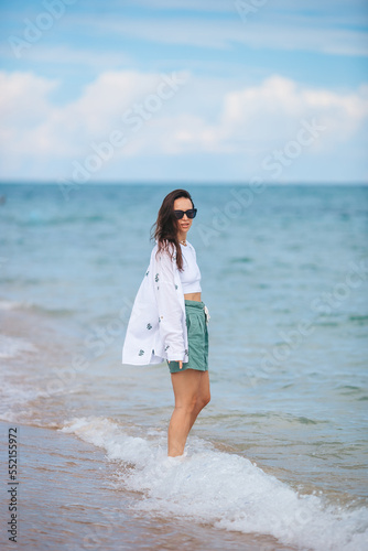 Young happy woman on the beach. 