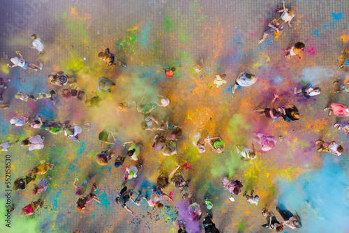 A group of happy people at the Holly Colors carnival.People throw Holi colors into the air. Top view,aerial photography