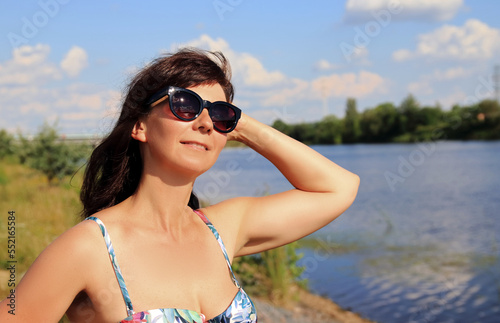 a woman on the beach sunbathing © sanek70974