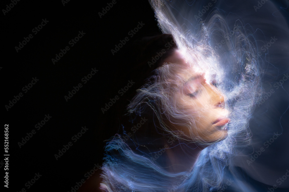 Abstract photography in the style of light painting. girl on a black background Abstract photography in the style of light painting. girl on a black background