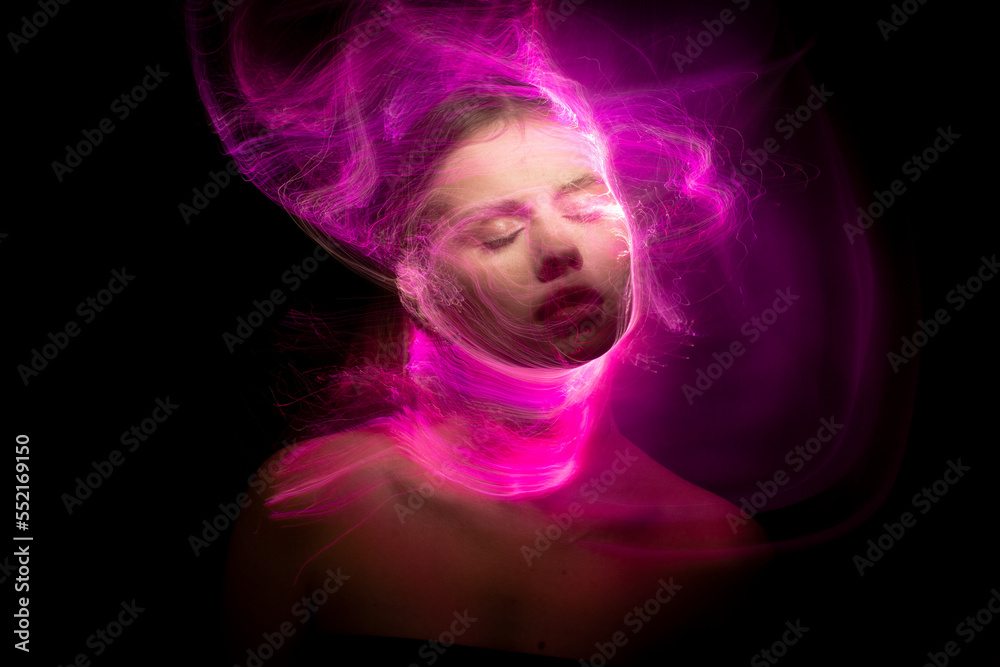Abstract photography in the style of light painting. girl on a black background Abstract photography in the style of light painting. girl on a black background