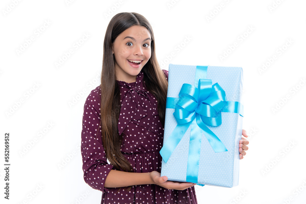 Teenager child with gift box. Present for holidays. Happy birthday, Valentines day, New Year or Christmas. Kid hold present box. Portrait of emotional amazed excited teen girl. Teenager child with gift box. Present for holidays. Happy birthday, Valentines day, New Year or Christmas. Kid hold present box. Portrait of emotional amazed excited teen girl.