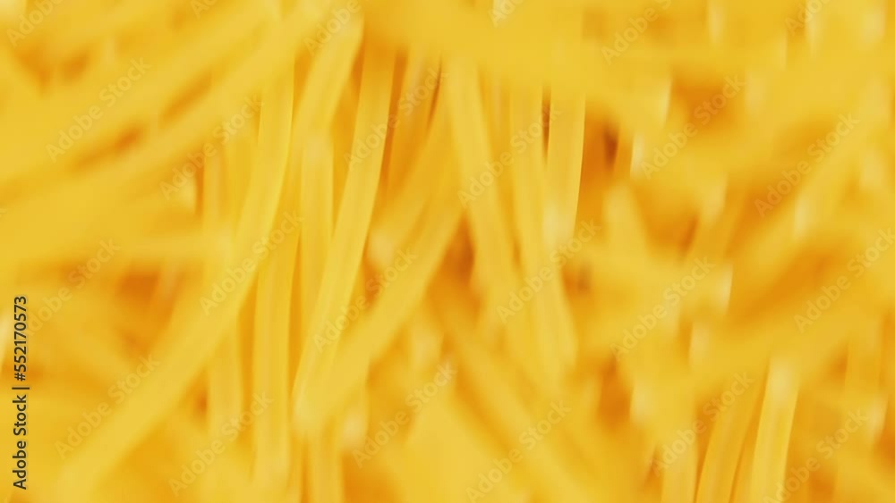 Background of Uncooked Noodles Moving Up - Top View, Close Up. Raw Pasta in Move. Texture of Dry Vermicelli Background of Uncooked Noodles Moving Up - Top View, Close Up. Raw Pasta in Move. Texture of Dry Vermicelli