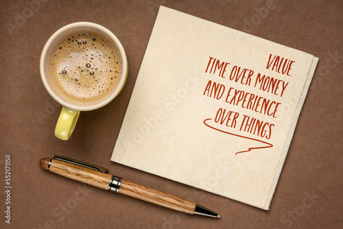 value time over money and experience over things - inspirational reminder or advice on a napkin with coffee, personal values and development concept