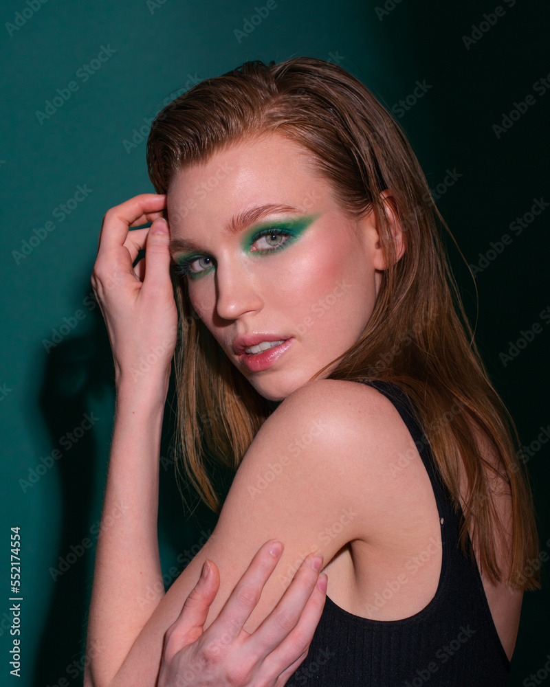 beauty portraits of a fashion girl on a green background beauty portraits of a fashion girl on a green background