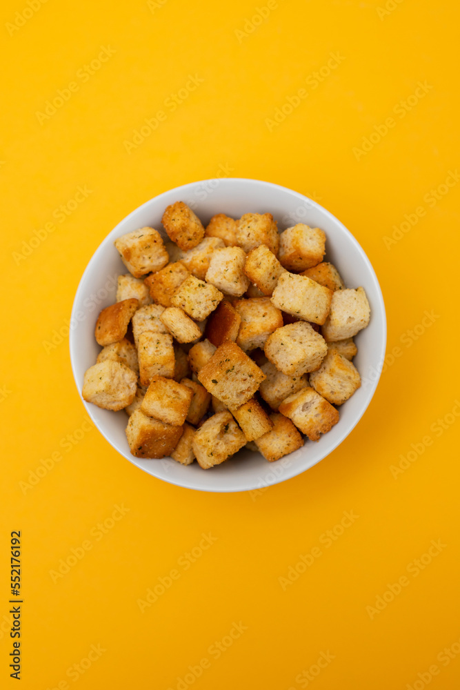 Crispy dry cubes of white bread in bowl Crispy dry cubes of white bread in bowl