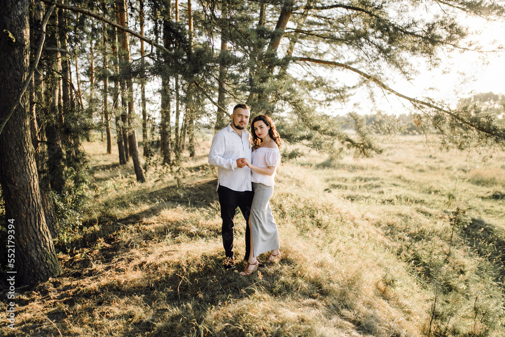 Young couple in love walking in the park