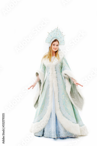 Snow Maiden in a traditional costume with a kokoshnik on a white background. 