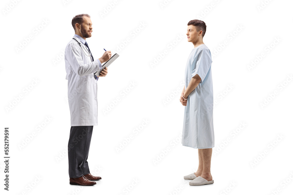 Full length profile shot of a male doctor and a young patient standing and talking