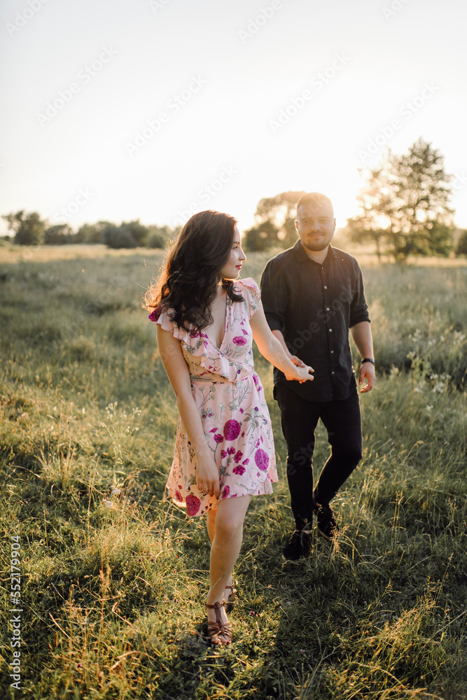 Young couple in love walking in the park Young couple in love walking in the park