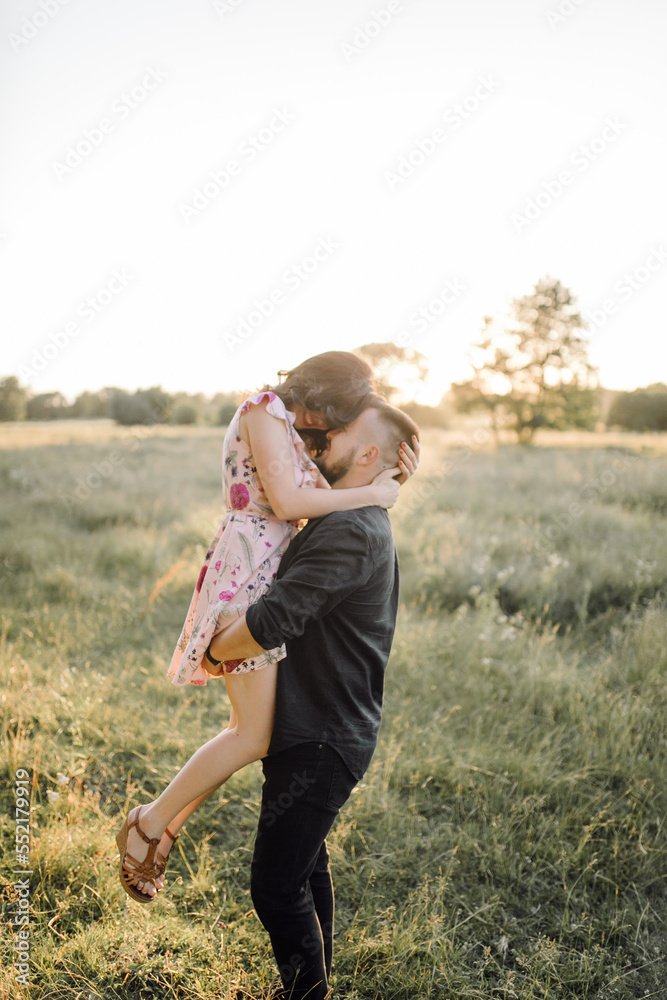 Young couple in love walking in the park