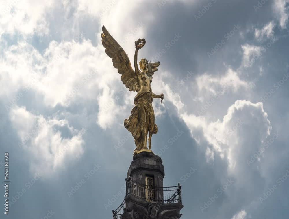 Time lapse of Angel of Independence in avenue of Mexico City Paseo de la Reforma avenue with cloudy sky, Mexico City, CDMX (Angel de la independencia) Time lapse of Angel of Independence in avenue of Mexico City Paseo de la Reforma avenue with cloudy sky, Mexico City, CDMX (Angel de la independencia)
