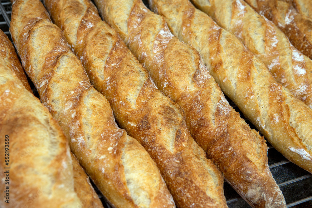 Stack of crispy baguettes at the bakery Stack of crispy baguettes at the bakery