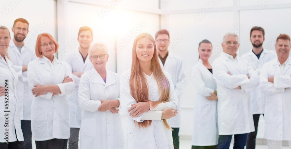 young researcher standing ahead of her senior colleagues. young researcher standing ahead of her senior colleagues.