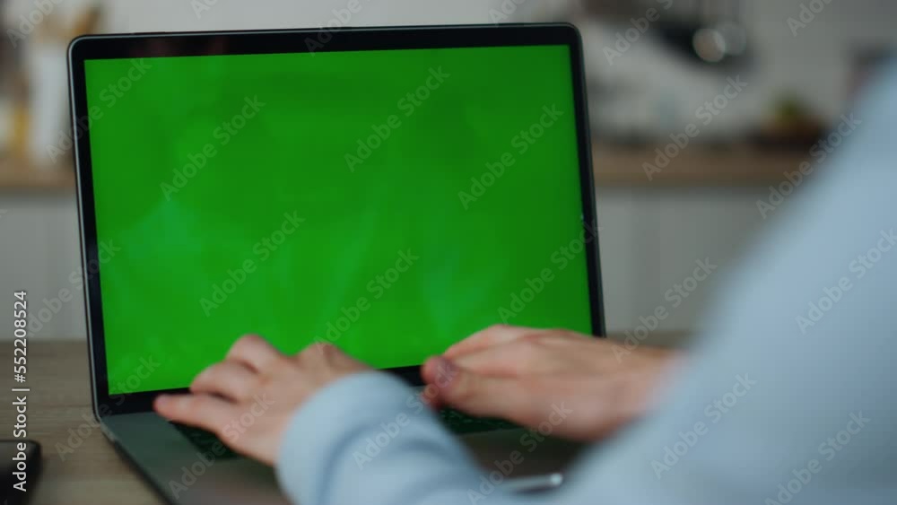 Hands typing greenscreen laptop at home close up. Freelancer working on computer Hands typing greenscreen laptop at home close up. Freelancer working on computer