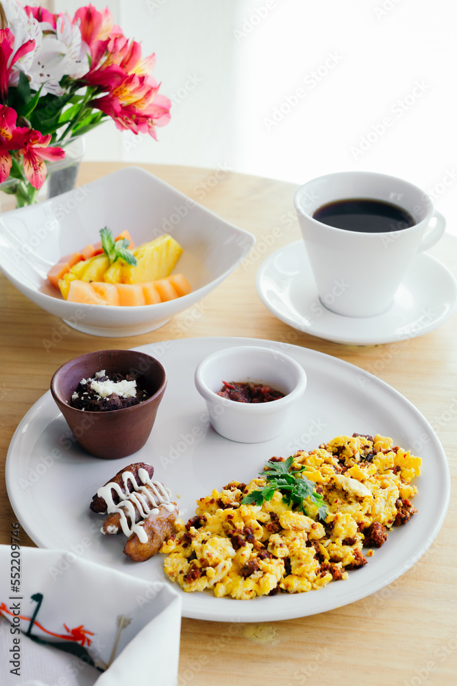 Delicious breakfast with fruit, juice and coffee on a white background. Food. Delicious breakfast with fruit, juice and coffee on a white background. Food.