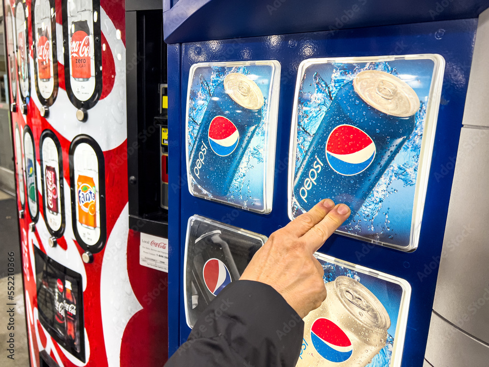 Los Angeles, CA, USA December 7 2022 Customer purchasing a can of Pepsi