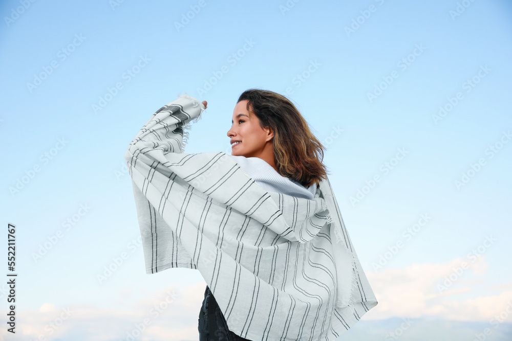 Portrait of beautiful young woman against blue sky Portrait of beautiful young woman against blue sky