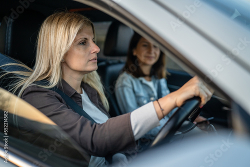 two women drive in a car travel mature caucasian female friends © Miljan Živković