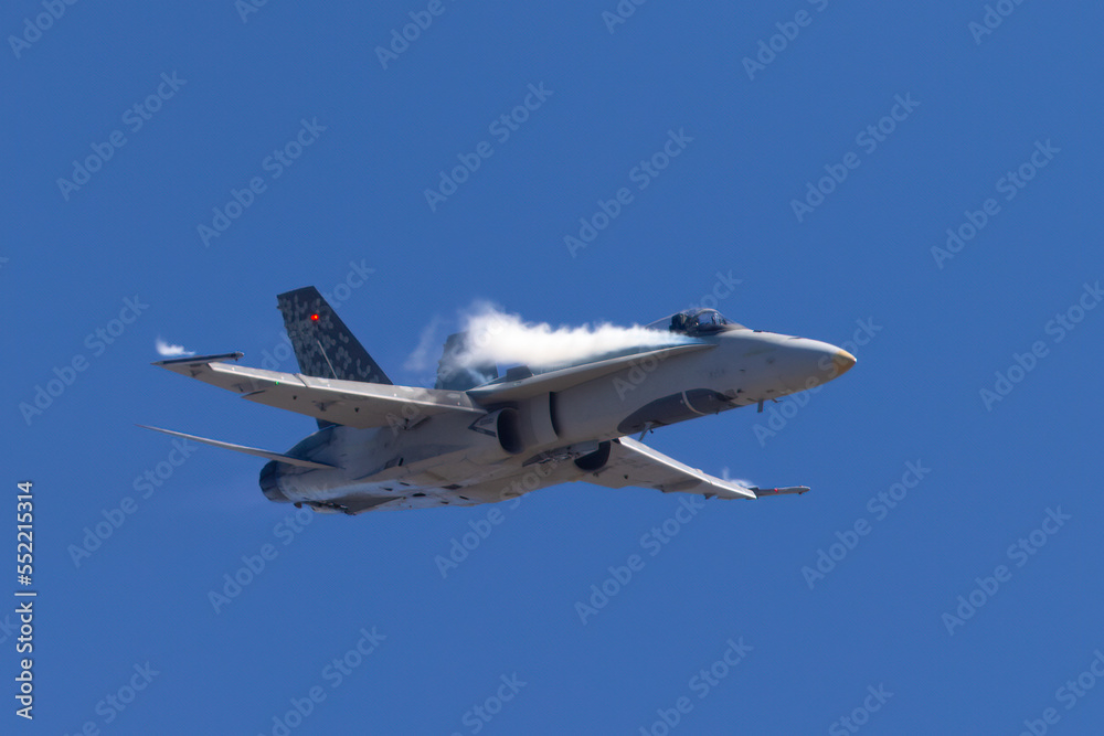Very close frontal view of a F-18 Hornet in a high G maneuver, with condensation streaks around the cockpit Very close frontal view of a F-18 Hornet in a high G maneuver, with condensation streaks around the cockpit