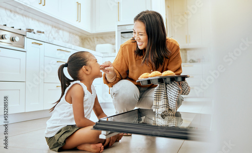 Cooking, cupcake and happy family of mother and child baking dessert food in oven and enjoy fun quality time together. Love, happiness and youth girl or kid bonding with mom, mama or woman in kitchen