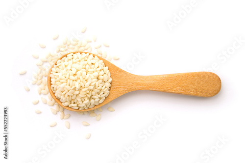 White sesame seeds in wooden spoon isolated on white background , top view , flat lay.