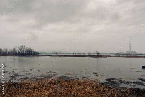 Toronto on a stormy day from Tommy Thompson Park with an industrial tower